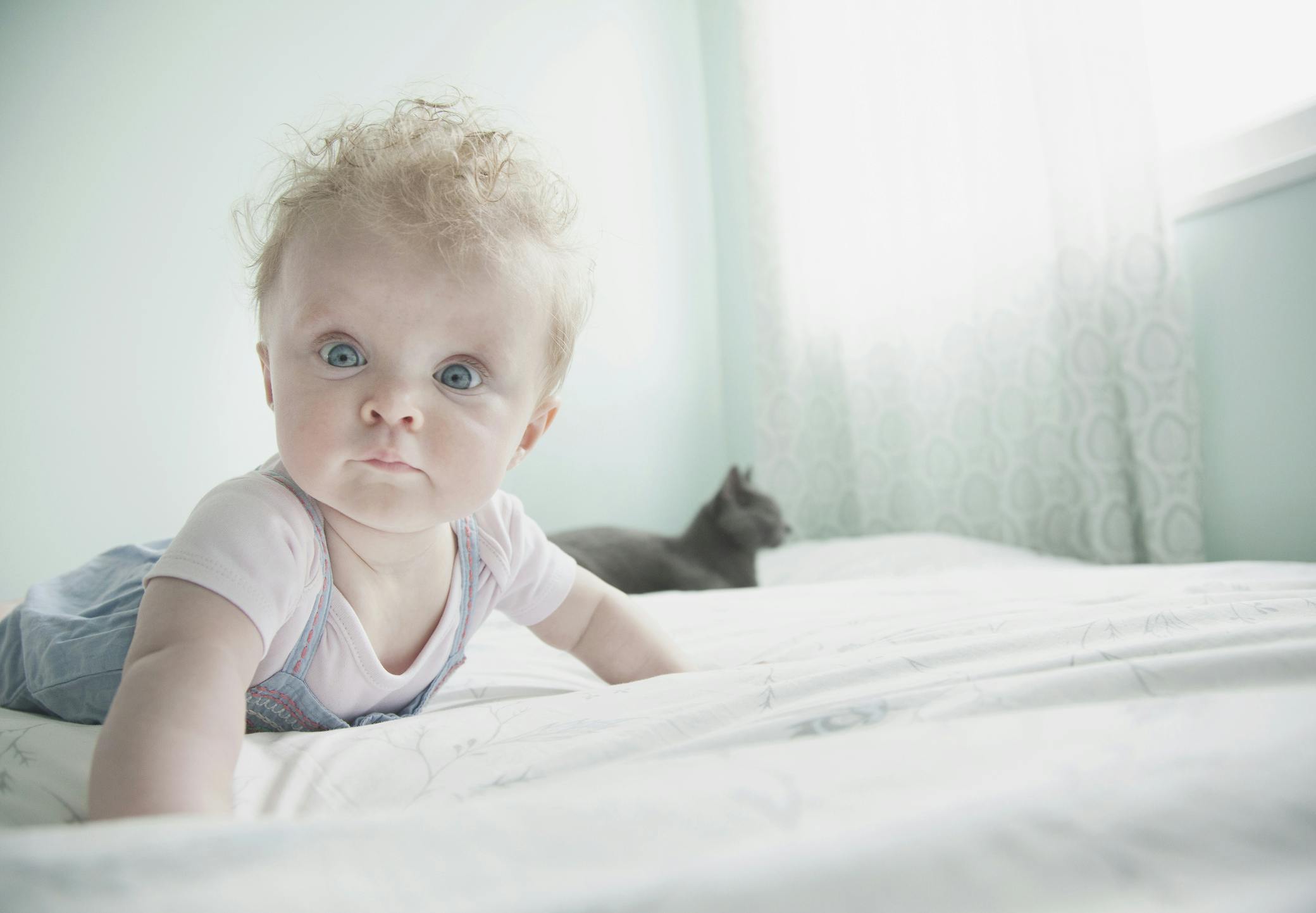 Baby with black cat.jpg?ixlib=rails 3.0