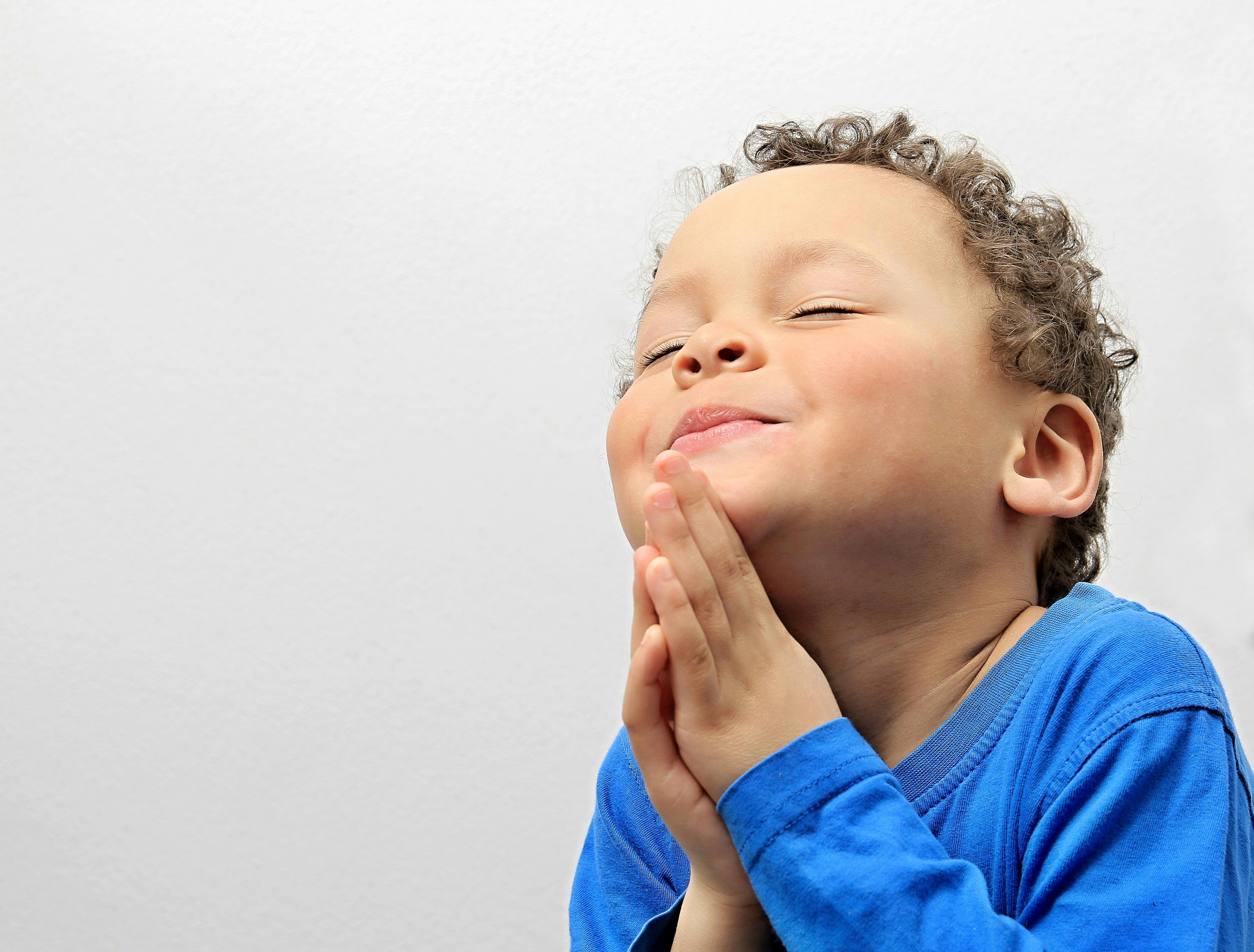 Boy praying.jpg?ixlib=rails 3.0